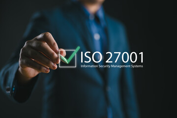 ISO 27001 concept. requirements, certification, management, standards. Businessman using tablet to...