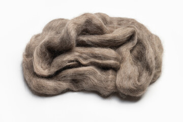 A skein of natural goat wool, isolated on a white background, close-up.