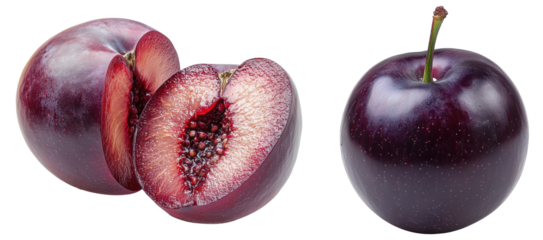Close-up of fresh plums with green leaves on white background.