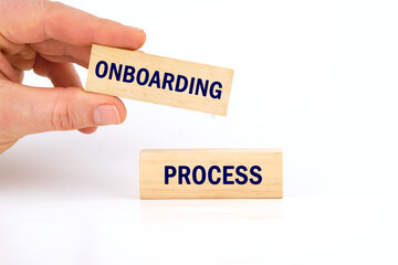 Onboarding Business Process New Employee Welcome Concept. Onboarding worker management. ONBOARDING PROCESS phrase made of wooden blocks is laid out on a white background