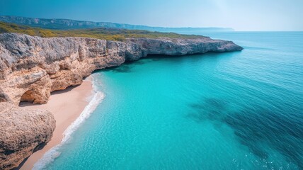Fototapeta premium Secluded cove with dramatic cliffs and crashing waves.