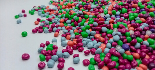 plastic masterbatch, pink polymer masterbatch granules, pink masterbatch granules with masterchip isolated on white background for plastic product catalog design manufacturing industry