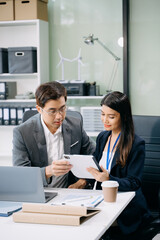 Happy businesspeople while collaborating on a new project in an office. Group of diverse businesspeople