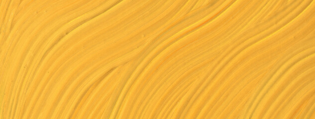 Abstract fluid art background yellow colors. Liquid marble. Acrylic painting with golden gradient.