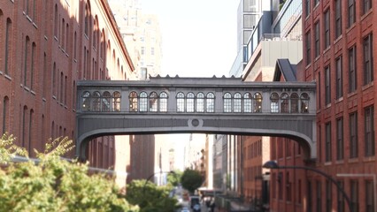 New York City street, Chelsea Market skybridge. Retro industrial architecture, red brick building. American old historic elevated sky bridge Manhattan landmark, USA. Meatpacking district, High Line.