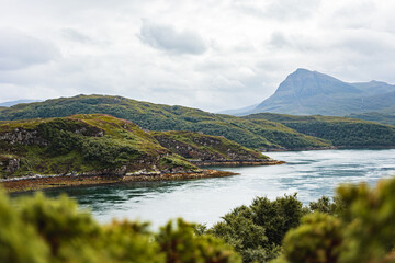 Misty mountains behind Loch Chairn Bhain in the scottish highlands