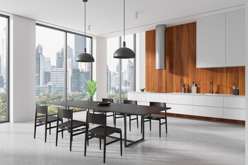 Home kitchen interior with dining table and cooking cabinet, panoramic window