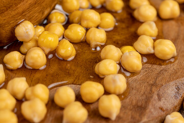 chickpeas porridge with honey during cooking