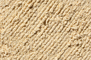 Abstract beige ground ginger background. Creativity in cooking.