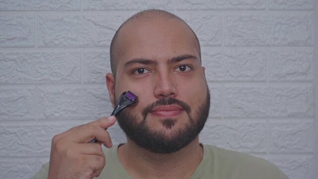 Man Usinf Derma Roller on Face