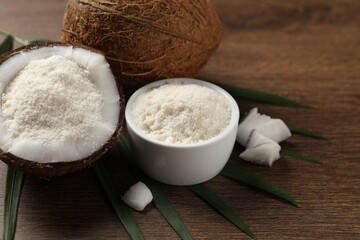 Coconut flour and fresh fruits on wooden table, closeup