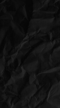 Video effects animation black paper background 4k abstract motion surface pattern vertical dark background