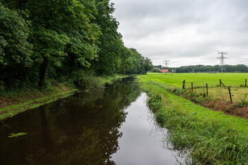 The Poelsbeek creek through the green wetlands around Markelo, Overijssel, The Netherlands