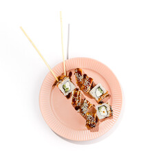 Unagi Roll with Eel and Cucumber, Canada Roll - Japanese Sushi Cuisine on Pink Plate