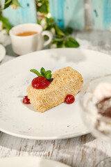 Napoleon Pastry with Berry Sauce in Sunlit Setting