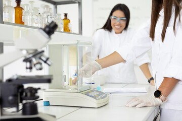 Scientists working with lab equipment in a laboratory