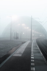 Foggy morning at Sloterdijk Station: cyclists and commuters navigate through the hustle of a...
