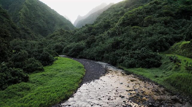 Teahupoo, Tahiti aerial drone of the river in the valley of mountains Orohena Aorai Ronui. French Polynesia 2024 Paris Olympics surfing spot. Paradise in Pacific Ocean. Moana Disney inspiration.