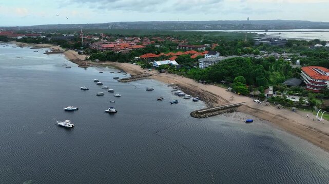 beautiful view of the sea, Aerial 4K Drone Footage: Tranquil Beauty of Tanjung Benoa Beach, Bali; Luxury Resorts, Turquoise Waters, and Golden Sands; Perfect for Travel Agencies, Resorts Promo