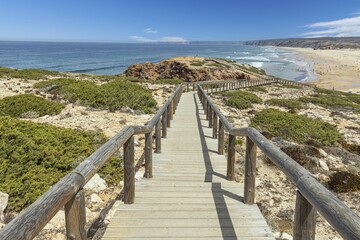 Obraz premium Scenic view of a pier on the Bordeiras beach in Portugal