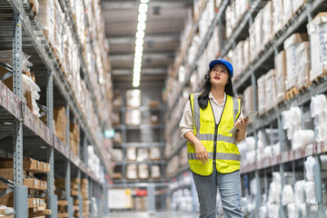 Female engineer is handling shipping and checking stock inventory in the warehouse with a tablet, industry, import-export, inventory management, logistics, global transportation at warehouse, business