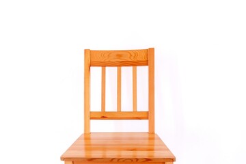 Front view of a wooden kitchen chair, on  a white background