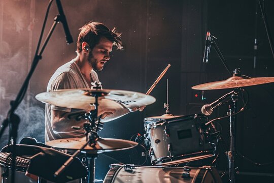 A young drummer passionately plays his kit on stage, surrounded by vibrant lights, capturing the audience's attention during an electrifying live performance