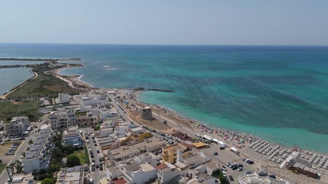 Torre Mozza is a coastal town in Salento, Puglia, known for its white sandy beaches and crystal-clear waters. The 17th-century tower, from which it takes its name, overlooks the scenic coastline