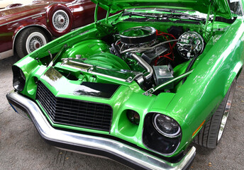 Classic old car with open hood showing restored engine