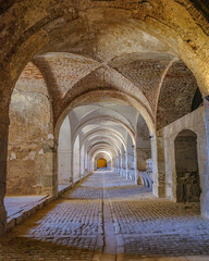 Obraz premium Figueres, Spain - 3 Aug, 2024: Horse stables within the Castillo de San Fernando (Sant Ferran Castle) military fortress, Figueres, Catalonia
