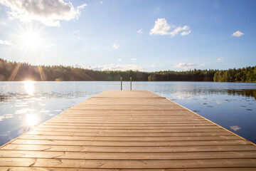 traditional finnish and scandinavian view beautiful lake on a summer day and an old rustic wooden dock or pier