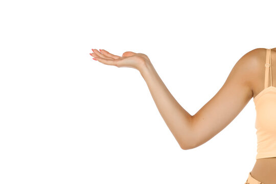 a bent female hand holds an imaginary object on a white background