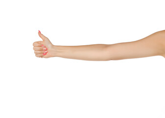 Fototapeta premium Female outstretched hand with thumb up on a white background