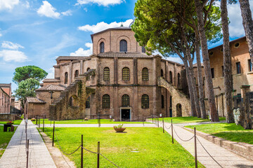 Obraz premium A view across the garden at the rear of the Basilica of San Vitale in Ravenna, Italy in summertime