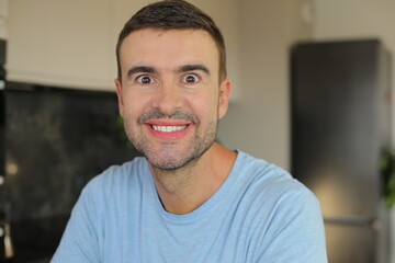 Offended man faking a smile 