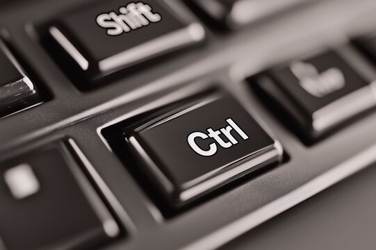 Macro shot of a keyboard focusing on the Ctrl and Shift keys, highlighting their importance in computer operations and shortcuts.