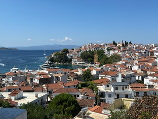 Fototapeta premium Scenic Coastal Town with Red-Tiled Roofs. Greece, Skiathos 