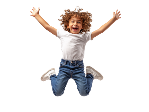 Joyful young child jumping high with excitement in bright indoor setting