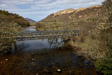 Looking North West at the A861 road Bridge at Ardmolich over the river Moidart and at the base of Drynie Hill, Highlands, Scotland