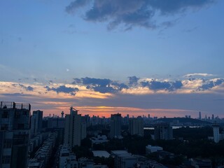 time clouds over city