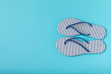 Flip flops on a bright colored background. Sandals. Summer Slippers. Vacation Concept. Rubber Slide Sandal . Top view. Space for text. Copy space