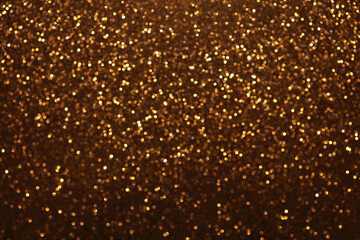 Golden glitter festive bokeh background, abstract defocused texture. Holiday lights