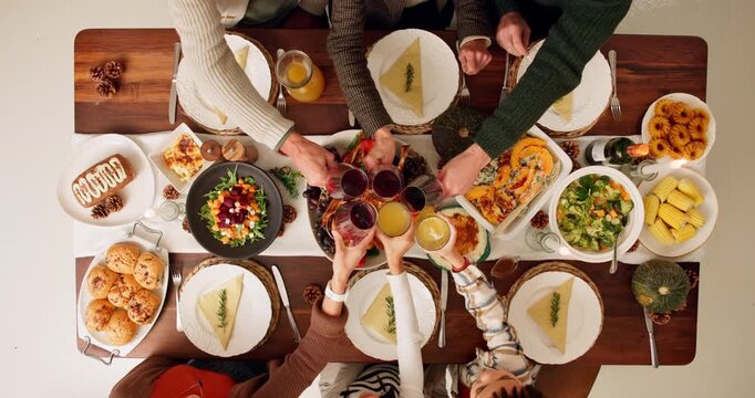 Above, family and cheers on dinner for thanksgiving celebration and reunion with wine glass. People, food and turkey on table at home to feast with unity, support and care with gathering at home