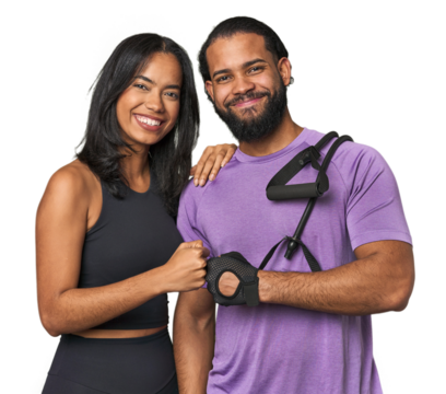 Sporty young Latino couple with elastic bands in studio