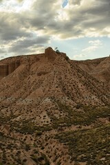 Dramatic Clouds Over Arid Canyon Landscape