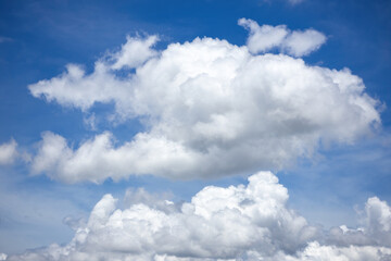 Obraz premium Beautiful fluffy white clouds in blue sky.