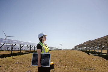 female technician working in solar power station