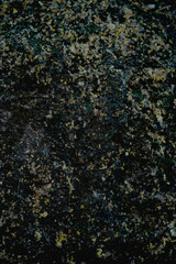 Empty rough brown black natural stone surface for abstract background and texture. beautiful patterns, space for work, banner, seamless wallpaper close up. Vertical.