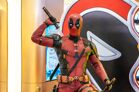 Bangkok, Thailand - Aug 03, 2024: Model of Deadpool, the iconic antihero from Marvel Comics. His red and black suit, of a movie called Deadpool Wolverine display at the cinema to promote the movie