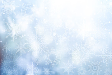 Christmas blurred background with snowflakes. Abstract blurred soft blue beautiful glowing blinking bokeh